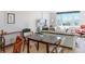 Bright living room featuring dining area, beach view, and comfortable seating with decor at 1100 Tarpon Center Dr # 102B, Venice, FL 34285