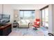 Comfortable living room featuring ocean views, modern furnishings, and access to outdoor space at 1100 Tarpon Center Dr # 102B, Venice, FL 34285