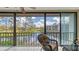Peaceful screened lanai with seating and a picturesque water view at 1130 Bird Bay Way # 184, Venice, FL 34285