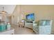 Open living room with tile flooring, comfortable seating and access to a dining area at 1130 Bird Bay Way # 184, Venice, FL 34285