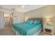 Relaxing main bedroom with beachy accents and easy access to the ensuite bath at 1130 Bird Bay Way # 184, Venice, FL 34285
