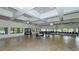 Spacious meeting room featuring tile flooring, ample natural light, and modern lighting fixtures at 1130 Bird Bay Way # 184, Venice, FL 34285