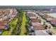This aerial shows a beautiful neighborhood with manicured lawns and well-maintained homes at 11700 Tapestry Ln, Venice, FL 34293