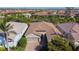Overhead view of a single-story home with an attached garage and well-manicured landscaping at 11700 Tapestry Ln, Venice, FL 34293