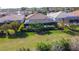A screened in swimming pool and spa are the focal points of this backyard with lush green grass at 11700 Tapestry Ln, Venice, FL 34293