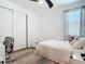 Cozy bedroom with ample light, closet and modern decor, perfect for relaxation at 11700 Tapestry Ln, Venice, FL 34293
