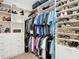 Walk-in closet with custom shelving and racks at 11700 Tapestry Ln, Venice, FL 34293