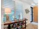 Entryway featuring wood floors, console table, stylish decor, and natural lighting at 11700 Tapestry Ln, Venice, FL 34293