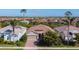 Lovely single-Gathering home featuring a neutral color scheme, two-car garage, and tropical landscaping at 11700 Tapestry Ln, Venice, FL 34293