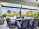 Inviting screened-in patio with ample seating, overlooking a private pool and lush landscaping at 11700 Tapestry Ln, Venice, FL 34293