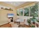 Bright Florida Room with beautiful views and a television for entertainment at 121 Auburn Woods Cir, Venice, FL 34292