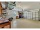 Spacious garage with workbench and utility sink offering ample storage and workspace at 121 Auburn Woods Cir, Venice, FL 34292