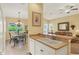 Bright kitchen overlooking the living and dining area, creating an open and inviting space at 121 Auburn Woods Cir, Venice, FL 34292