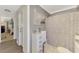 Full bathroom with a shower-tub combo, storage, and neutral color scheme at 1281 Wilson Dr, Englewood, FL 34224