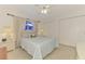 Bright bedroom featuring neutral decor, carpet, ceiling fan, and ample closet space at 1281 Wilson Dr, Englewood, FL 34224