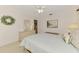 Comfortable bedroom with carpet, ceiling fan, plush bedding, and closet at 1281 Wilson Dr, Englewood, FL 34224