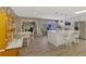 Bright, open kitchen features an island with marble countertops and stainless steel appliances at 1281 Wilson Dr, Englewood, FL 34224