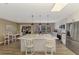 Spacious kitchen featuring a large center island, stainless appliances, and pendant lighting at 1281 Wilson Dr, Englewood, FL 34224