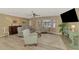 Comfortable living room with wood floors, ceiling fan and plenty of natural light from the bay window at 1281 Wilson Dr, Englewood, FL 34224
