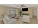 Inviting living room with hardwood floors, bay window, and modern decor, creating a welcoming atmosphere at 1281 Wilson Dr, Englewood, FL 34224