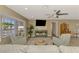 Relaxing living room with wood floors, a large bay window, and a neutral color palette throughout at 1281 Wilson Dr, Englewood, FL 34224