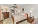 Cozy bedroom featuring a ceiling fan, carpet, and two windows with natural light at 1281 Wilson Dr, Englewood, FL 34224
