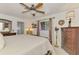 Charming bedroom features plush bedding, ceiling fan, and warm accents at 1281 Wilson Dr, Englewood, FL 34224