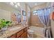Bathroom featuring a single sink, granite countertops, and a tiled shower and bathtub combo at 13215 Amerigo Ln, Venice, FL 34293
