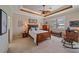 Bedroom featuring a wood bed frame, neutral walls, wood ceiling accents and plantation shutters at 13215 Amerigo Ln, Venice, FL 34293