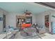 Inviting covered patio with comfortable seating and ceiling fan, ideal for relaxing outdoors at 13215 Amerigo Ln, Venice, FL 34293