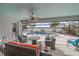 Screened patio with comfortable seating area overlooking the pool and lake views at 13215 Amerigo Ln, Venice, FL 34293