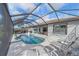 Beautiful pool and deck area with lounge chairs and umbrella, perfect for enjoying sunny days at 13215 Amerigo Ln, Venice, FL 34293