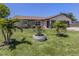 Charming single-story home with lush lawn and mature palm trees in a desirable location at 1340 Olympia Rd, Venice, FL 34293