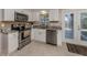 Well-equipped kitchen features stainless steel appliances and a breakfast bar area at 1340 Olympia Rd, Venice, FL 34293