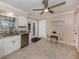 Bright kitchen with white cabinets, granite countertops, and stainless steel appliances at 1340 Olympia Rd, Venice, FL 34293
