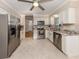 Updated kitchen with stainless steel appliances, granite countertops, and ample cabinet space at 1340 Olympia Rd, Venice, FL 34293
