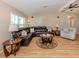 Spacious living room with neutral walls, a ceiling fan and comfortable furnishings at 1340 Olympia Rd, Venice, FL 34293