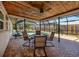 Covered patio with a ceiling fan overlooking a sparkling swimming pool, perfect for outdoor entertaining at 1340 Olympia Rd, Venice, FL 34293