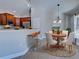 Open concept eat-in kitchen with stainless steel appliances, modern cabinetry, and a tile floor at 14352 Pocono Ave, Port Charlotte, FL 33981
