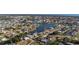 Waterfront community with homes, docks, and boats along a winding river with access to the ocean at 1440 Overbrook Rd, Englewood, FL 34223