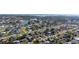Aerial view of a neighborhood with single-Gathering homes and mature trees in a coastal Florida community at 1440 Overbrook Rd, Englewood, FL 34223