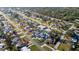 Aerial view of a neighborhood featuring a home with a private pool and mature landscaping at 1440 Overbrook Rd, Englewood, FL 34223
