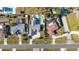 An aerial view shows a beautiful neighborhood with homes featuring pools and lovely landscaping at 1440 Overbrook Rd, Englewood, FL 34223
