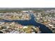 Waterfront homes with docks and boats along the river in a coastal community with a nearby golf course at 1440 Overbrook Rd, Englewood, FL 34223