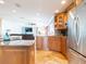 Spacious kitchen featuring stainless steel appliances, a center island, and modern finishes at 1440 Overbrook Rd, Englewood, FL 34223