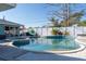 Sparkling in-ground pool with spa and inviting outdoor seating, perfect for relaxation and entertaining at 1440 Overbrook Rd, Englewood, FL 34223
