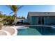 Backyard oasis featuring a sparkling pool, manicured landscaping, and an inviting patio at 1440 Overbrook Rd, Englewood, FL 34223