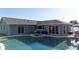 In-ground pool and spa offering a serene backyard retreat with lush landscaping at 1440 Overbrook Rd, Englewood, FL 34223