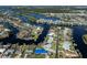 Aerial view of canal-front homes with docks, showcasing waterfront living and stunning neighborhood views at 1503 Marlin St, Nokomis, FL 34275