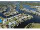 Stunning aerial view of a waterfront home with beautiful surroundings and direct access to waterways at 1503 Marlin St, Nokomis, FL 34275